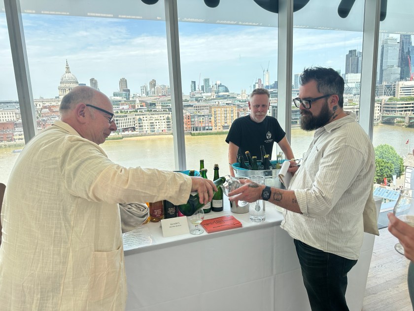 Tom Oliver pours Brett a cider.