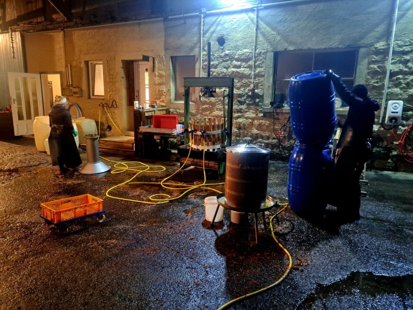 Cleaning cider equipment into the night