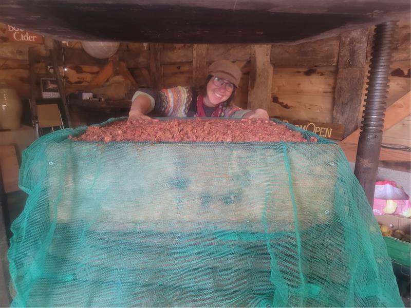 Chava by her fruit press