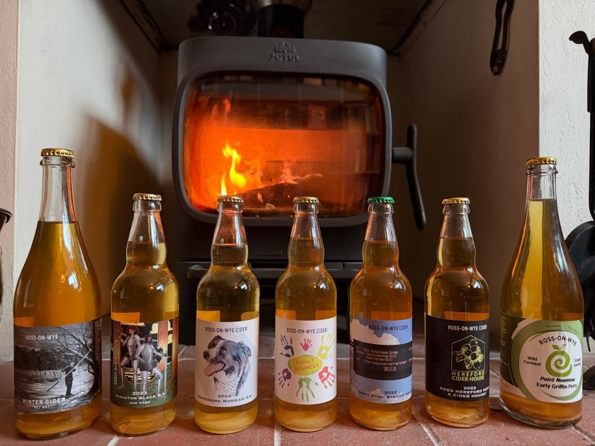 A selection of Ross Cider bottlings in front of the stove
